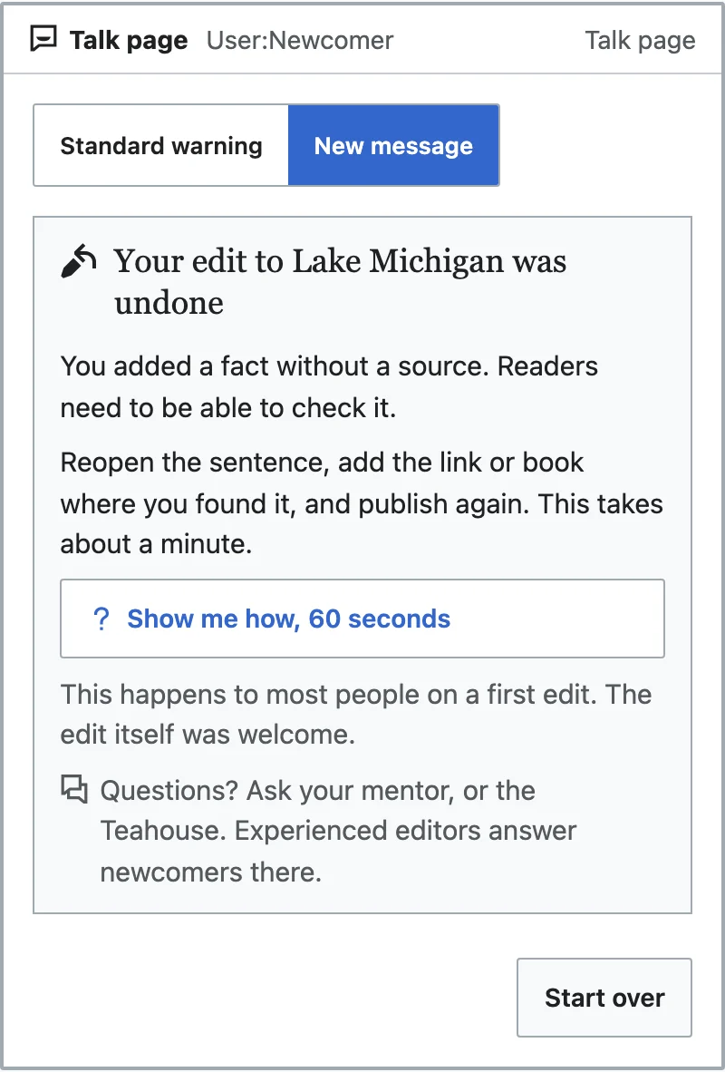 A talk-page message headed 'Your edit to Lake Michigan was undone'. It says the fact had no source, shows how to add one and publish again in about a minute, offers a sixty-second how-to, says this happens to most people on a first edit, and points to a mentor or the Teahouse.